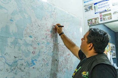 Suazo points out on a map all the territories in which JCVH already has a presence and those they want to reach.