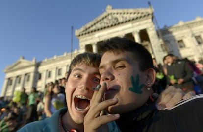 Activists share a joint in front of the Senate in Montevideo.