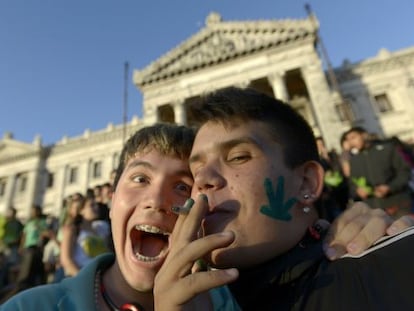 Activists share a joint in front of the Senate in Montevideo.