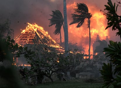 The historic Waiola Church and nearby Hongwanji Mission are devoured by flames on Tuesday, August 8, 2023, in Lahaina, Hawaii.