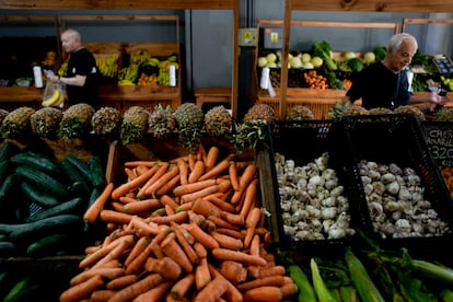 Shoppers buy vegetables in Buenos Aires on Monday. South America's second largest economy is suffering 143% annual inflation. 