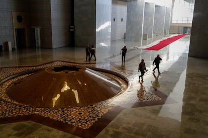 Syrian opposition fighters walk inside the Presidential Palace after the Syrian government collapsed in Damascus, Syria, Sunday, Dec. 8, 2024. (AP Photo/Omar Sanadiki)