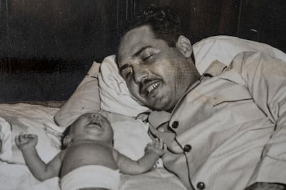 A photograph of Toitico with his newborn son Pepín in 1950. 