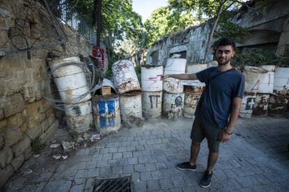 Federico Ribechi points to one of the barricaded borders in Nicosia.