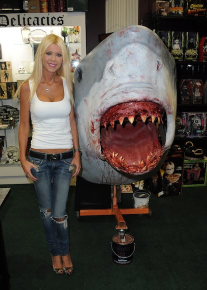 Tara Reid at a promotional event for 'Sharknado,' a franchise that poked fun at shark-themed terror.