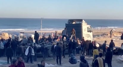 Palestinians transport casualties following what Palestinian health officials said was Israeli fire on people waiting for aid, in Gaza City, in this still picture taken from a video February 29, 2024