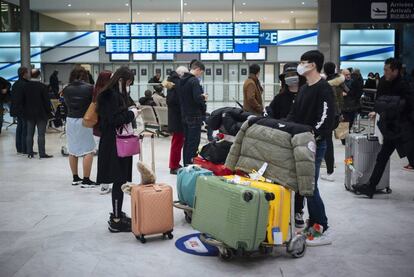 Passengers arrive in France from Beijing.