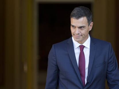 Spain's Prime Minister Pedro Sanchez steps out of the Moncloa Palace in Madrid, Spain, Wednesday, Sept. 12, 2018. Sanchez, who became prime minister in June promising to root out corruption, lost a culture minister over a tax fine and Spain's health minister resigned Tuesday over irregularities found in her master's degree. His center-left government has been marred by erratic policy-making, with several U-turns on cabinet decisions. (AP Photo/Paul White)