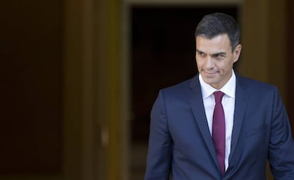 Spain's Prime Minister Pedro Sanchez steps out of the Moncloa Palace in Madrid, Spain, Wednesday, Sept. 12, 2018. Sanchez, who became prime minister in June promising to root out corruption, lost a culture minister over a tax fine and Spain's health minister resigned Tuesday over irregularities found in her master's degree. His center-left government has been marred by erratic policy-making, with several U-turns on cabinet decisions. (AP Photo/Paul White)