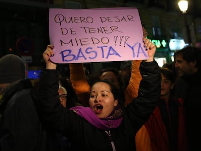 A protestor with a sign reading: “I wnat to stop being afraid! Enough is enough.”