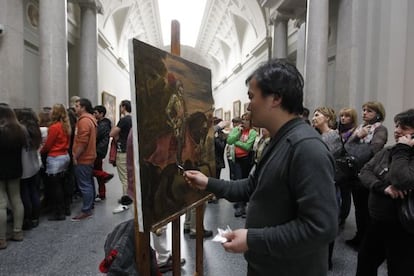 An artist creates a reproduction of one of the works in Madrid's Prado Museum.