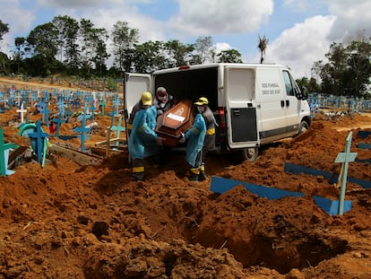 Cemetery workers burying a coronavirus victim in Manaus, Amazonas state, Brazil, on January 6.