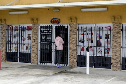 A customer stands in front of a closed business participating in the national "A Day Without Immigrants" movement, in Houston, Texas, on February 3.