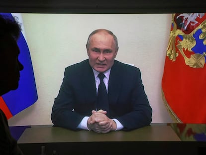 A woman watches the video of Vladimir Putin’s address to the nation following the attack on the Crocus City Hall on Friday, March 23, 2024, in the Russian city of Krasnogorsk.