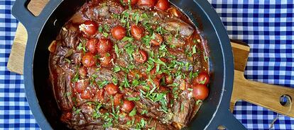 Baked eggplant with tomato and parsley.