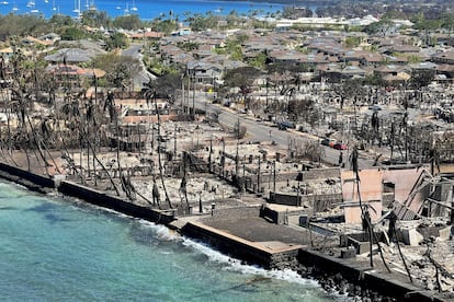 The shells of burned houses and buildings are left after wildfires driven by high winds burned across most of the town in Lahaina, Maui, Hawaii, on August 11, 2023.