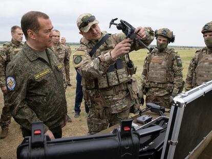 Russian Security Council Deputy Chairman and the head of the United Russia party Dmitry Medvedev, left, visits the Prudboy military training ground in the Volgograd region of Russia on June 1, 2023.