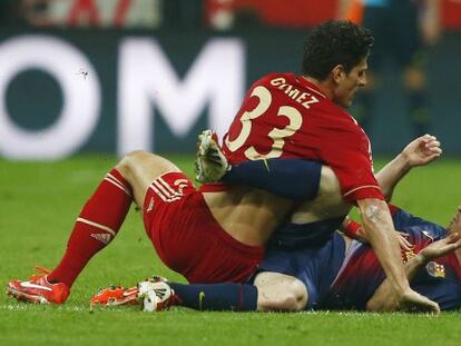 Bayern Munich&rsquo;s Mario Gomez gets up close and personal with Leo Messi in the German side&rsquo;s crushing victory Tuesday.  