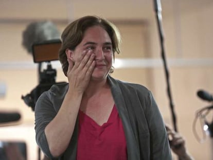 Ada Colau wipes a tear from her eye after winning the Barcelona mayoral race.