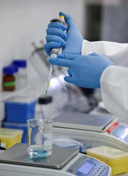 A scientist works with samples at a WHO-supported mRNA vaccine center in Cape Town, South Africa.