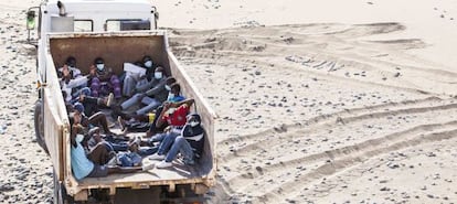 The migrants were driven away in a garbage truck.
