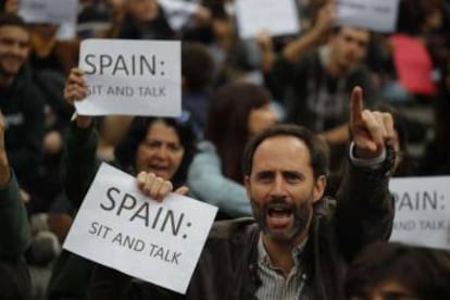 Protesters holding signs in Barcelona on Monday.