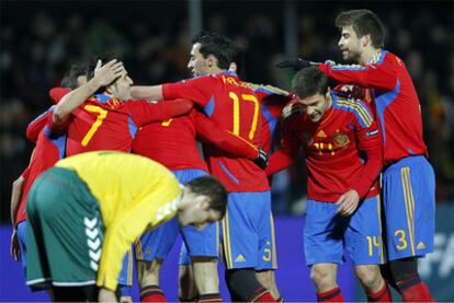 Spain's players celebrate Xavi's goal.