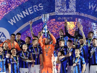 Inter Milan's goalkeeper Samir Handanovic holds the trophy as he celebrates with his teammates after winning the Italian Super Cup final soccer match between AC Milan and Inter Milan at the King Saud University Stadium, in Riyadh, Saudi Arabia, Wednesday, Jan. 18, 2023.