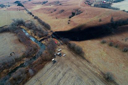 In this photo taken by a drone, cleanup continues in the area where the ruptured Keystone pipeline dumped oil into a creek in Washington County, Kan., on Dec. 9, 2022.