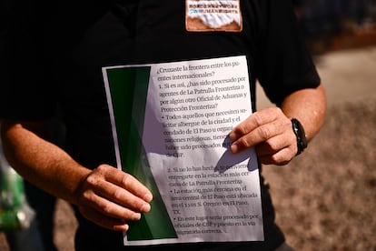 Fernando García, executive director of the NGO Red de la Frontera por los Derechos Humanos, holds up the flyer that was distributed to migrants on Tuesday urging them to surrender to border officials.