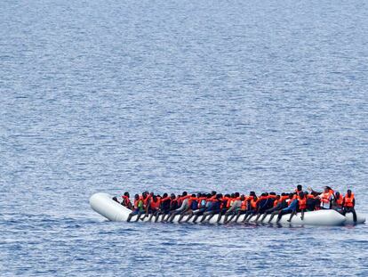 Immigrants await a rescue ship in the Mediterranean on June 18.