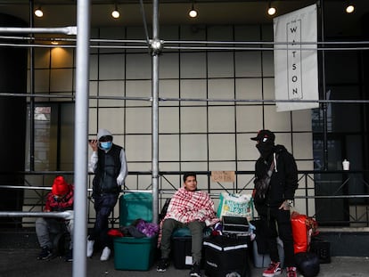 Migrants camp with their belongings on the sidewalk in front of the Watson Hotel in New York, on Jan. 30, 2023.