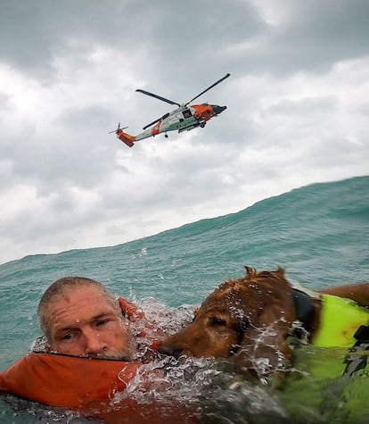 A U.S. Coast Guard Air Station crew rescues a man and his dog during Hurricane Helene after his sailboat became disabled and started taking on water off Sanibel Island, Florida, U.S. September 26, 2024.  