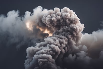 A cloud of white smoke swirling against a dark background.