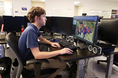 A meteorologist with the U.S. National Weather Service monitors the weather in Phoenix, Arizona, July 12.