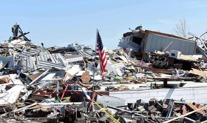 A new American flag flies over a storm-damaged area after a tornado struck in Rolling Fork, Mississippi, on March 26, 2023.