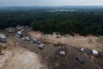 Boats and houseboats are stuck in a dry area of the Negro River during a drought in Manaus, Amazonas state