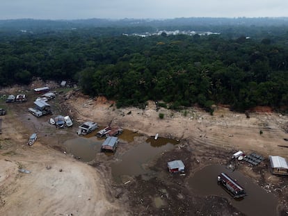 Boats and houseboats are stuck in a dry area of the Negro River during a drought in Manaus, Amazonas state