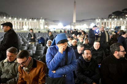 Faithful pray the rosary in St. Peter's Square in Rome for the Pope's health, during an event held on Monday night.