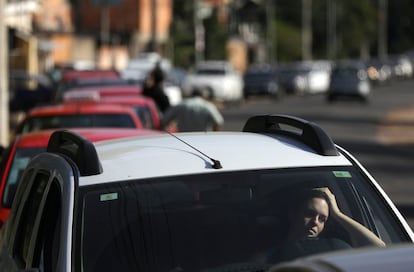 A woman waits in line at a gas station in Porto Alegre, Brazil May 29, 2018. REUTERS/Diego Vara