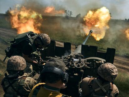 Ukrainian soldiers fire a cannon near Bakhmut, the eastern city where fierce battles against Russian forces have been taking place, in the Donetsk region, Ukraine, Monday, May 15, 2023.