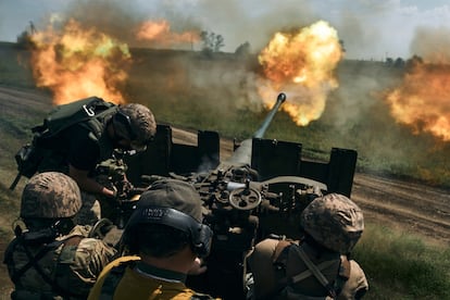 Ukrainian soldiers fire a cannon near Bakhmut, an eastern city where fierce battles against Russian forces have been taking place, in the Donetsk region, Ukraine