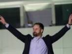 Santiago Abascal, leader of far-right Vox Party, gestures to supporters outside the party headquarters after the announcement of the general election first results, in Madrid, Spain, Sunday, Nov. 10, 2019. Spain's Interior Ministry says that early results show Socialists winning Spain's national election, but without a clear end to the country's political deadlock. Vox is also surging to become the country's third political force, more than doubling its presence in the parliament's lower house from 24 to 53 deputies only six months after its debut. (AP Photo/Andrea Comas)