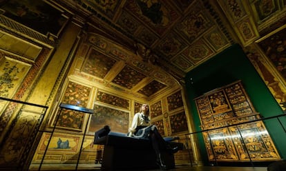 A museum assistant poses within a Parisian "cabinet" room from the reign of Louis XVI, within the Victoria and Albert museum's new "1600-1815" galleries in London on December 7, 2015. The V&A's seven new gallery areas hold nearly 1,100 objects and will open to the public on 9 December, 2015. 
AFP PHOTO / LEON NEAL