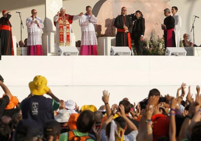 The pope greets pilgrims on his arrival at Madrid's Plaza de Cibeles.