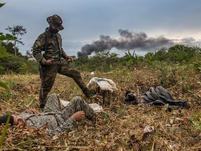 Soldiers rest after destroying a drug laboratory in the Colombian jungle.