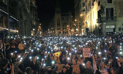 Protesters take part in a demonstration on Sunday near Barcelona’s police headquarters.