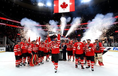 The captain of the Canadian national team lifts the trophy on February 20 in Boston.