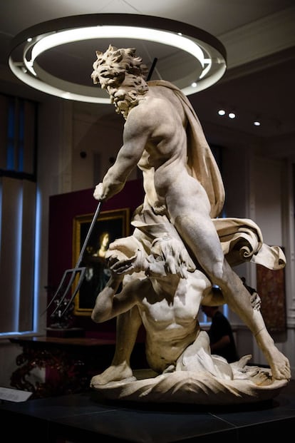 A statue of Neptune and Triton is displayed in the Victoria and Albert museum's new "1600-1815" galleries in London on December 7, 2015. The V&A's seven new gallery areas hold nearly 1,100 objects and will open to the public on 9 December, 2015. 
AFP PHOTO / LEON NEAL