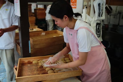 Sales assistant at the Nakatanidou store, in the Japanese city of Nara.